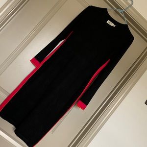 Black form fitting sweater dress. Worn once for short time